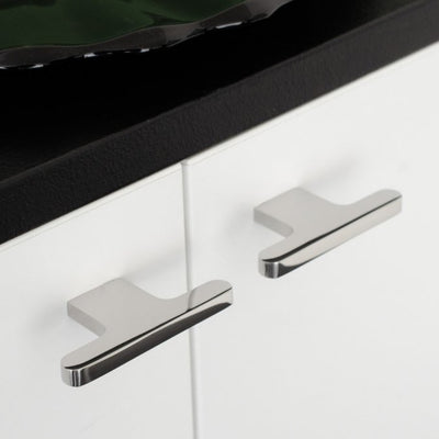 T shaped knobs in polished stainless steel mounted on a white cabinet