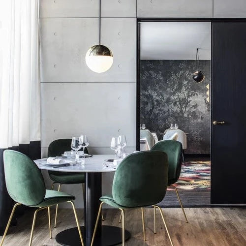 Vervloet Bubbles lever on a black door in a restaurant dining room.