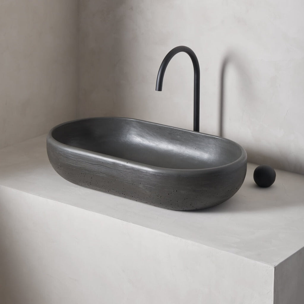 An oversized, obround washbowl with softened curves and high, round-over basin walls