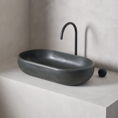 An oversized, obround washbowl with softened curves and high, round-over basin walls
