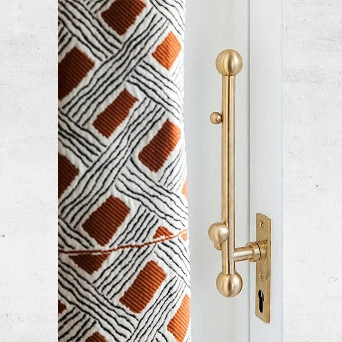 Vervloet Bubbles door pull beside a patterned column.