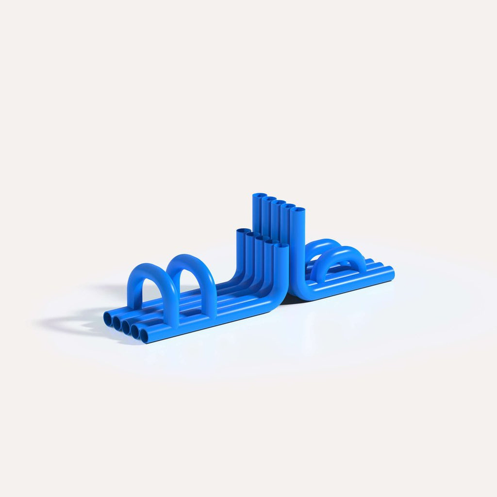 Blue TUBE Bookends photographed on an angle on a white background