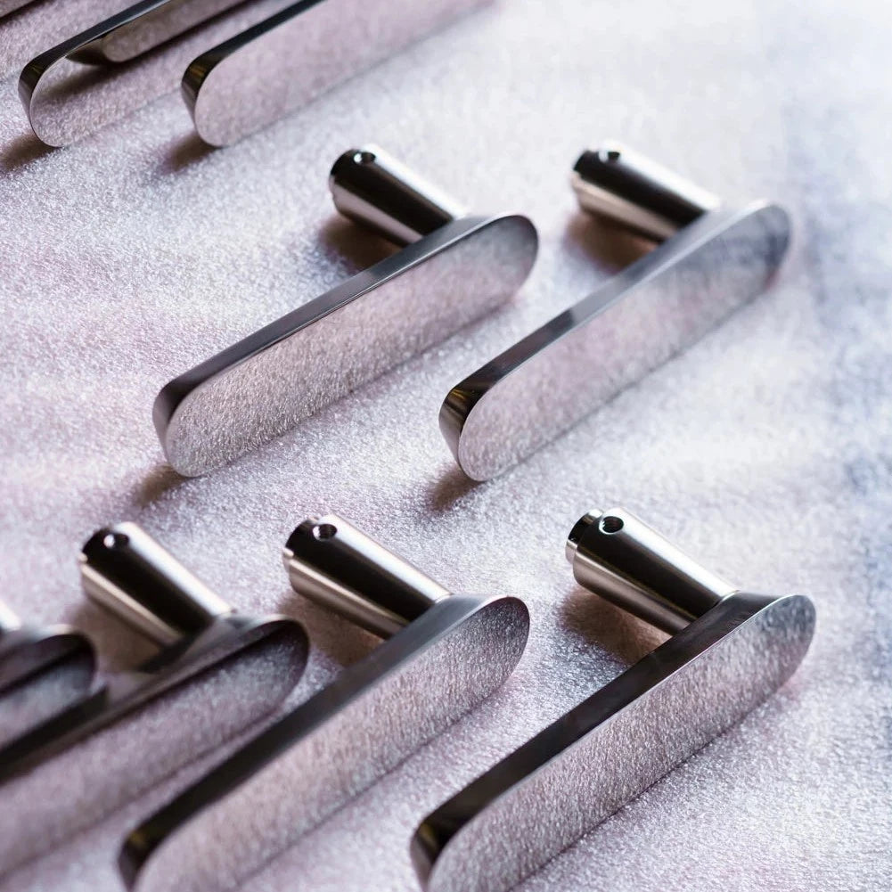 Nickel Vervloet Audrey door levers arranged in rows.