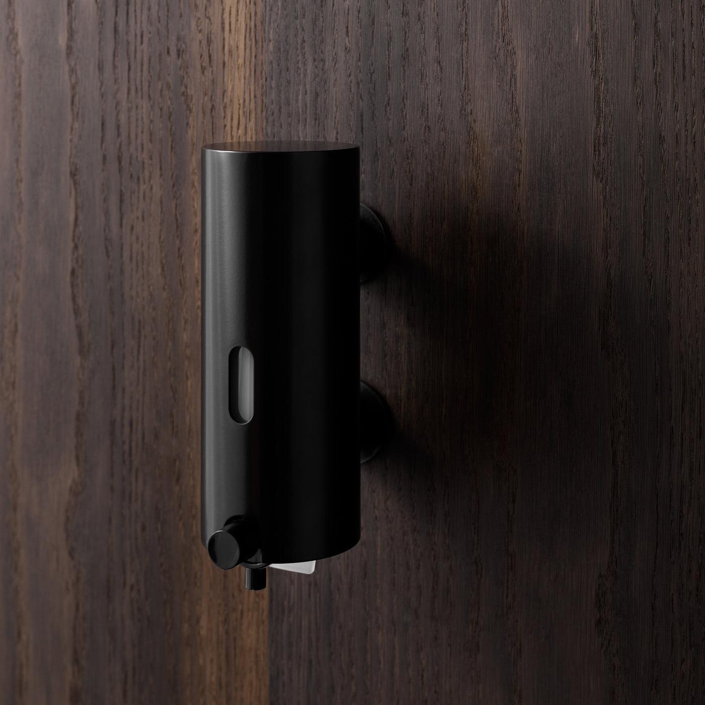 The Knud Soap Dispenser is part of the sanitary line by d line and is available for residential or commercial use.  Shown here in black.