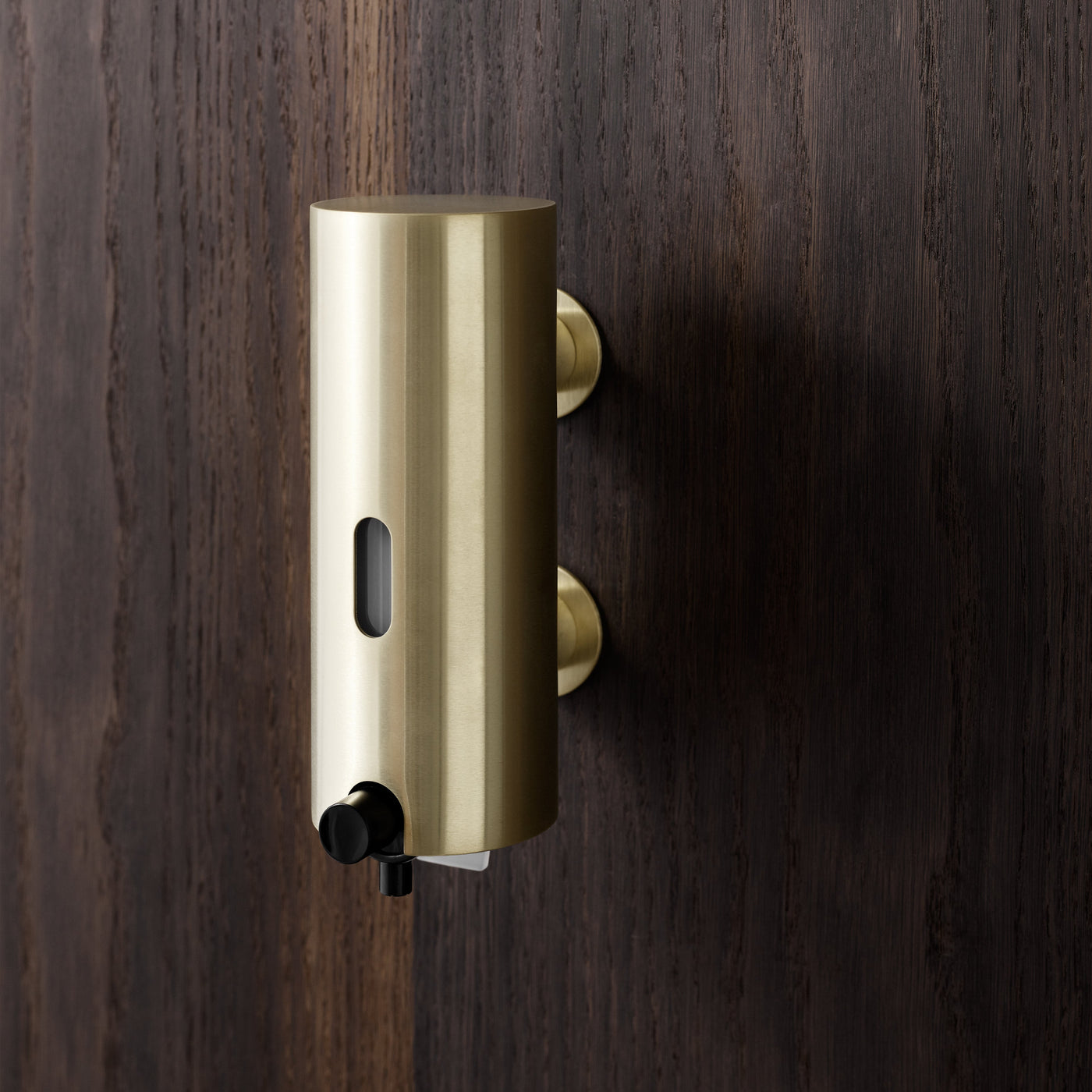 The Knud Soap Dispenser is part of the sanitary line by d line and is available for residential or commercial use.  Shown here in brass.
